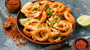 Uma explosão de sabor e textura: crocantes por fora, macios por dentro. Esses anéis de cebola são assados até dourar, sem óleo, sem culpa, só prazer puro. A mistura de especiarias traz um toque defumado e picante que vai conquistar seu paladar.